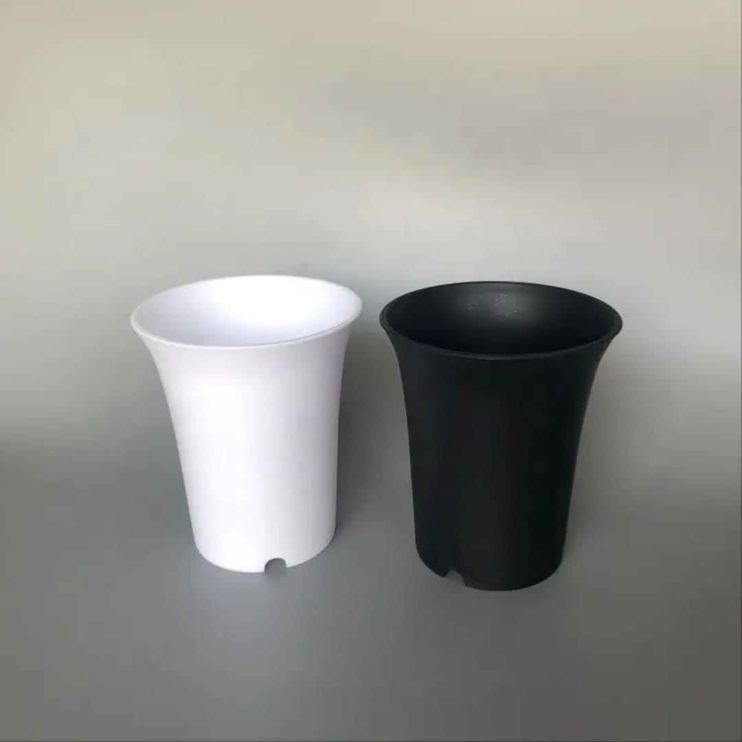 Tall round plastic pot — drainage hole detail