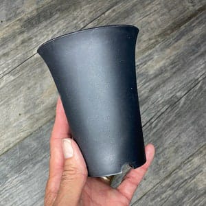 Tall round plastic pot — side angle